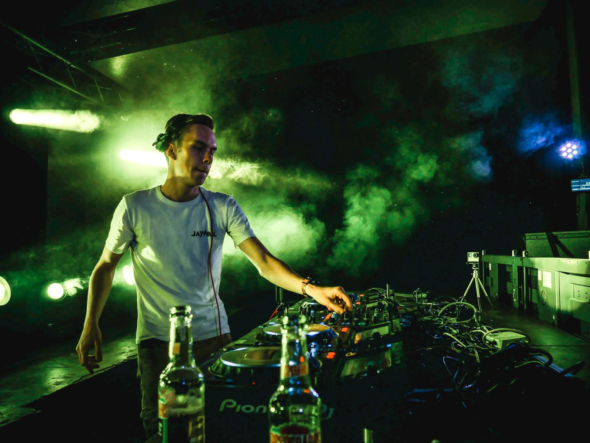 dj using a mixer on a set